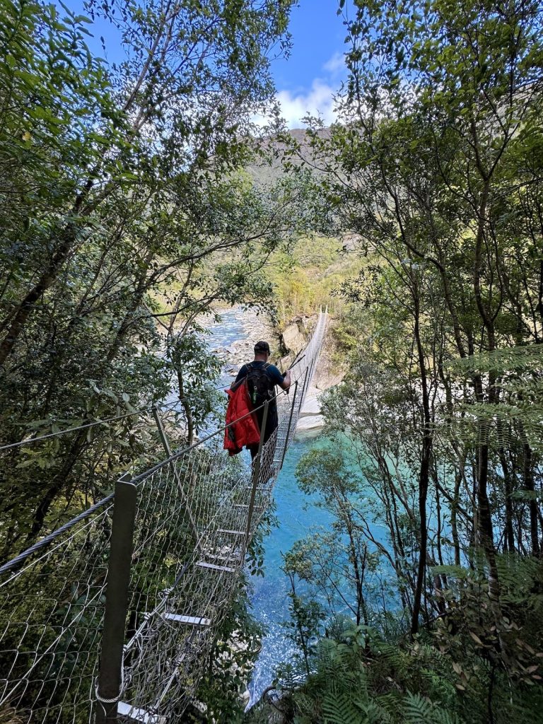 Nathan crossing the bridge at Cesspool Gorge.