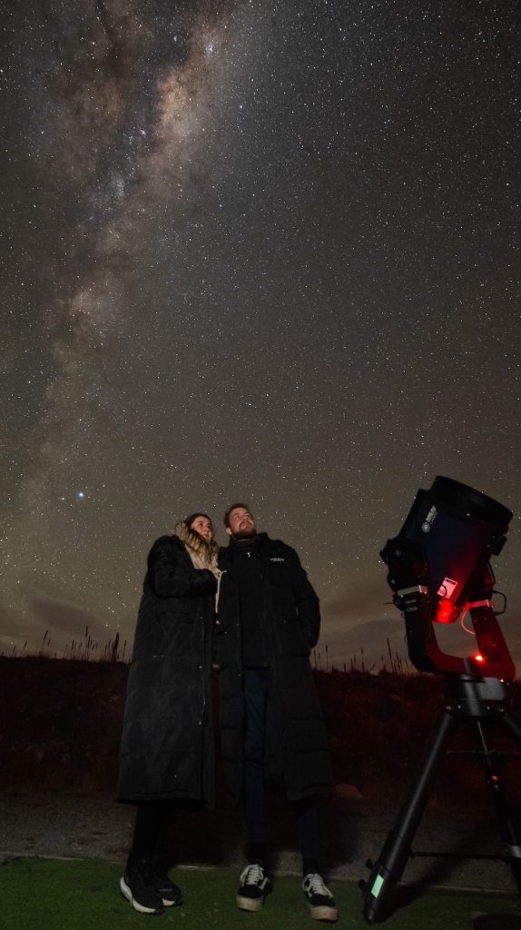 A couple stargazing in Twizel.
